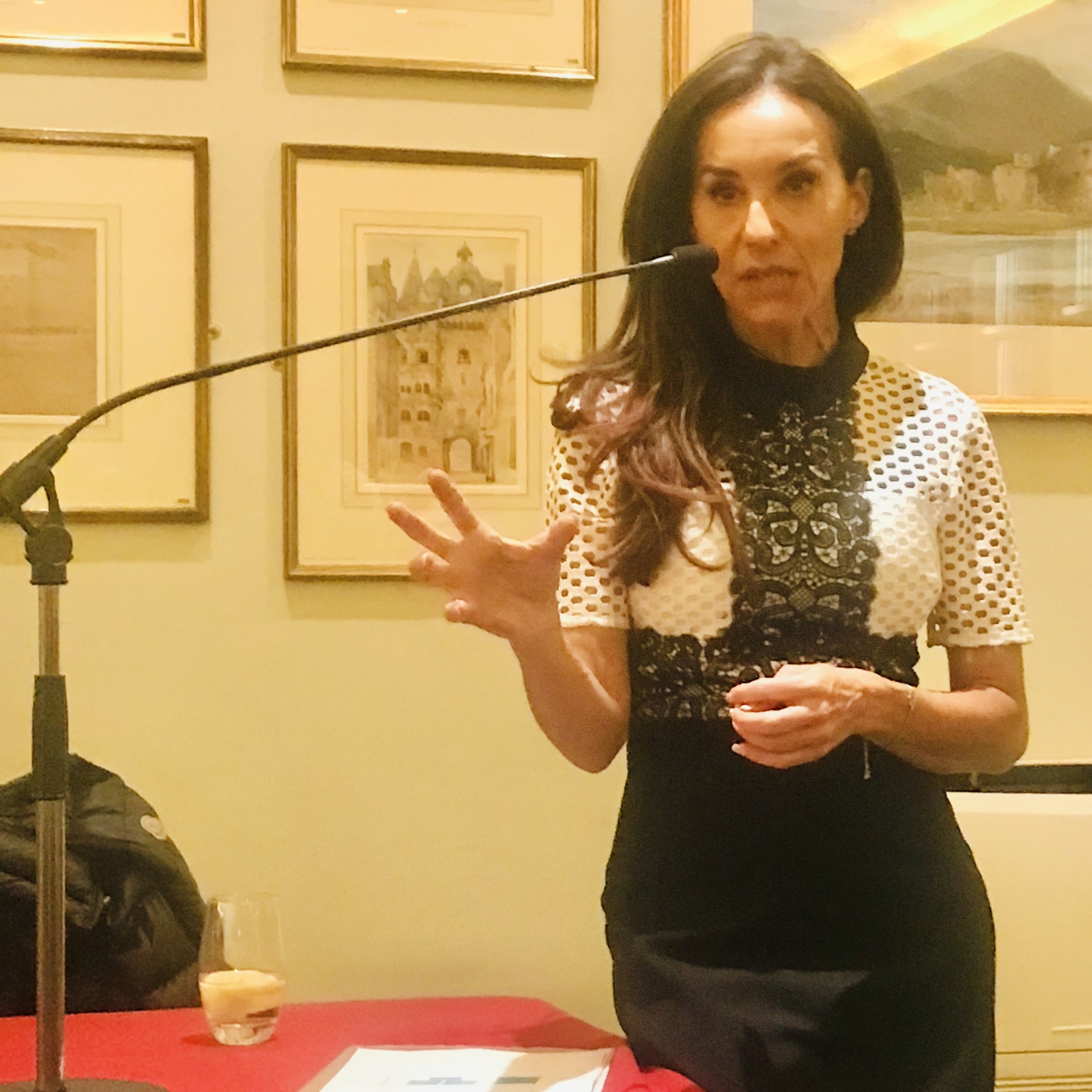 Sammy Margo speaking at an evening event